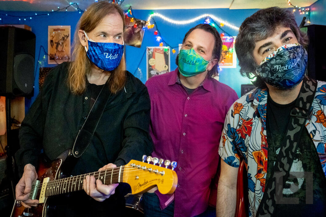 Portrait of rock band TELL wearing The Vote Mask