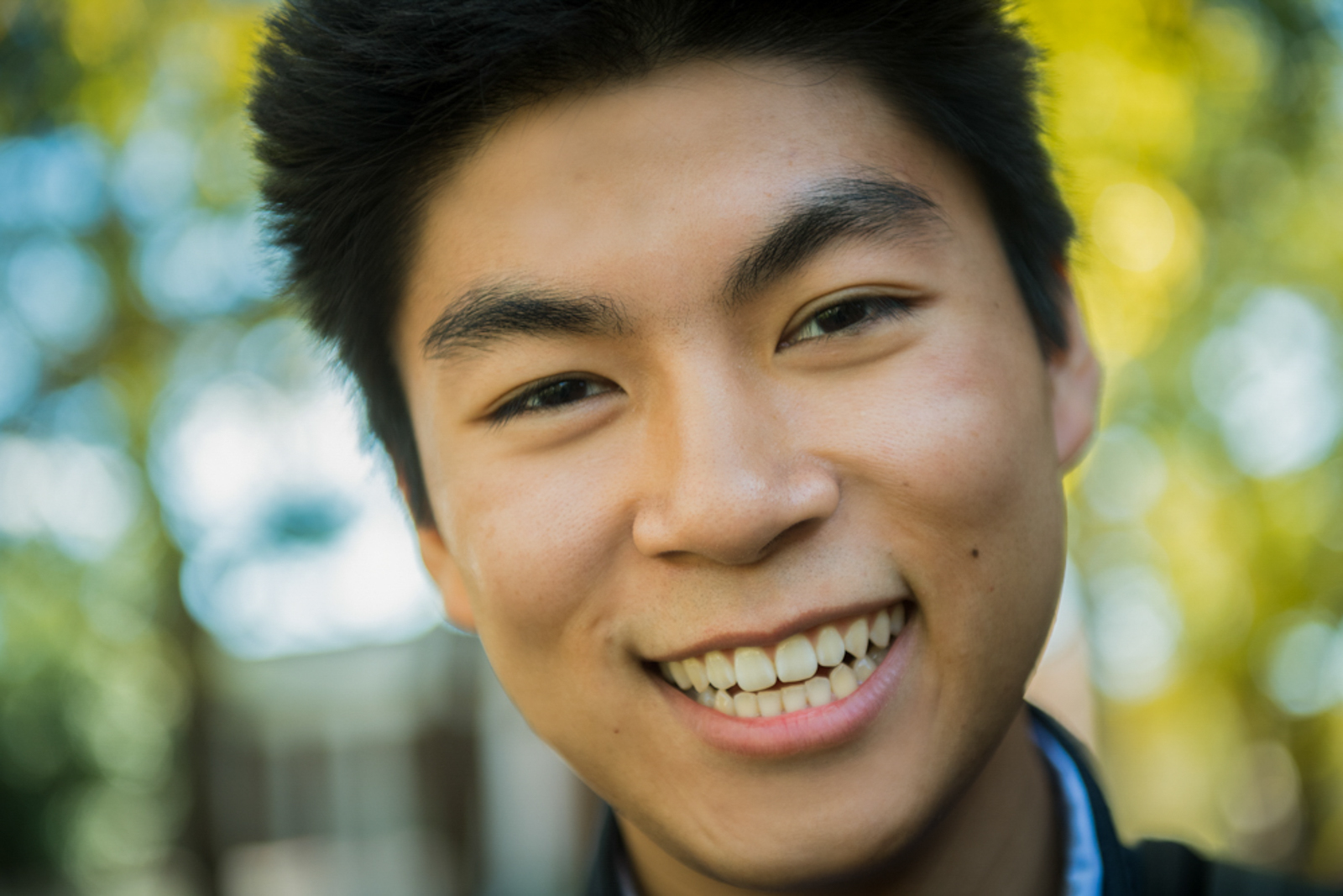 Close up of male student with a wide smile