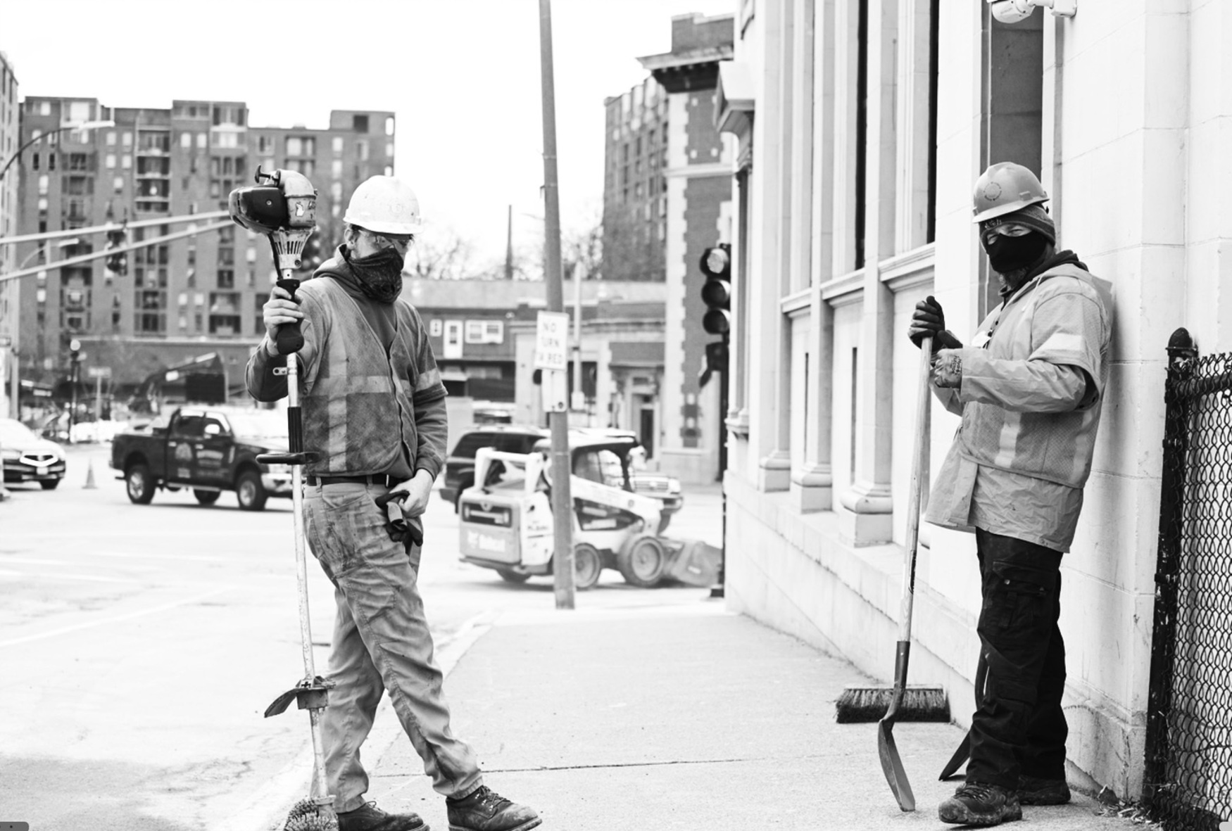 utility workers on sidewalk