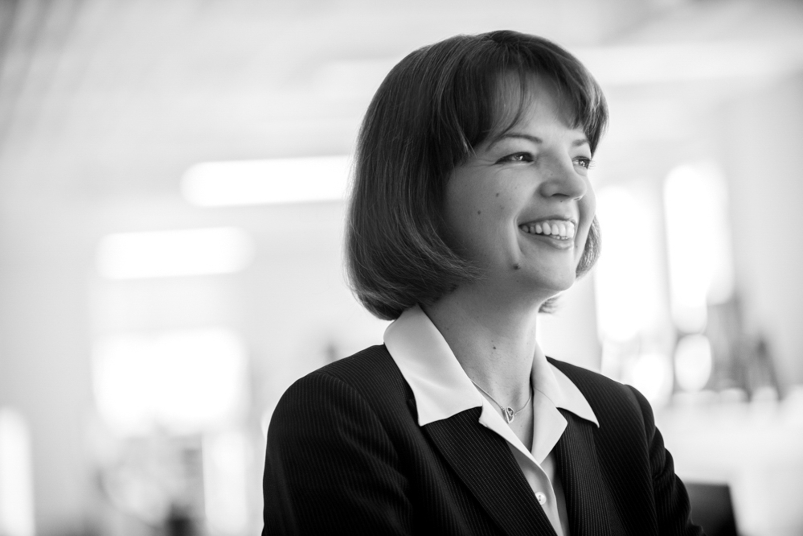 Black and White portrait of business woman smiling confidently