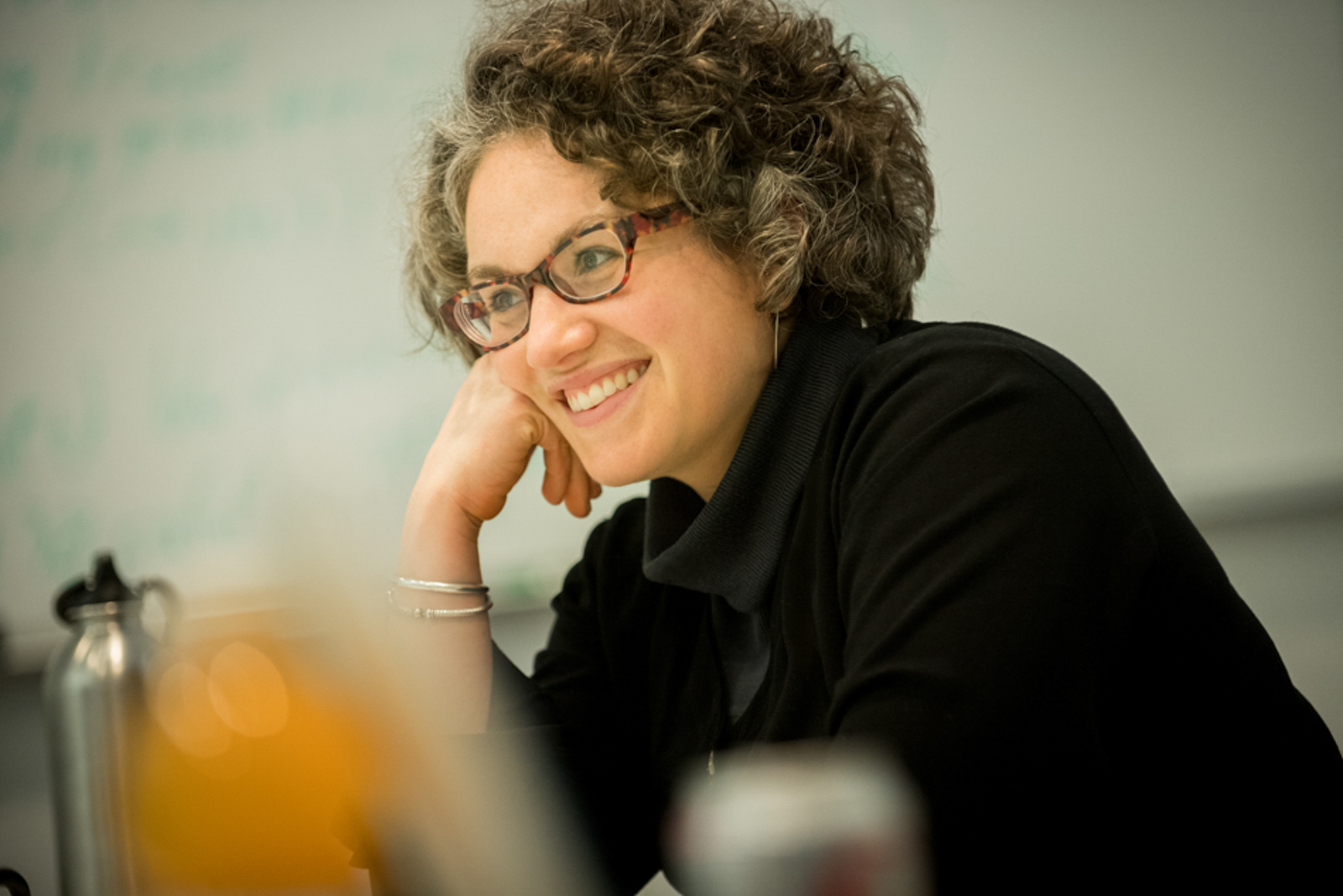Candid of woman smiling during a meeting