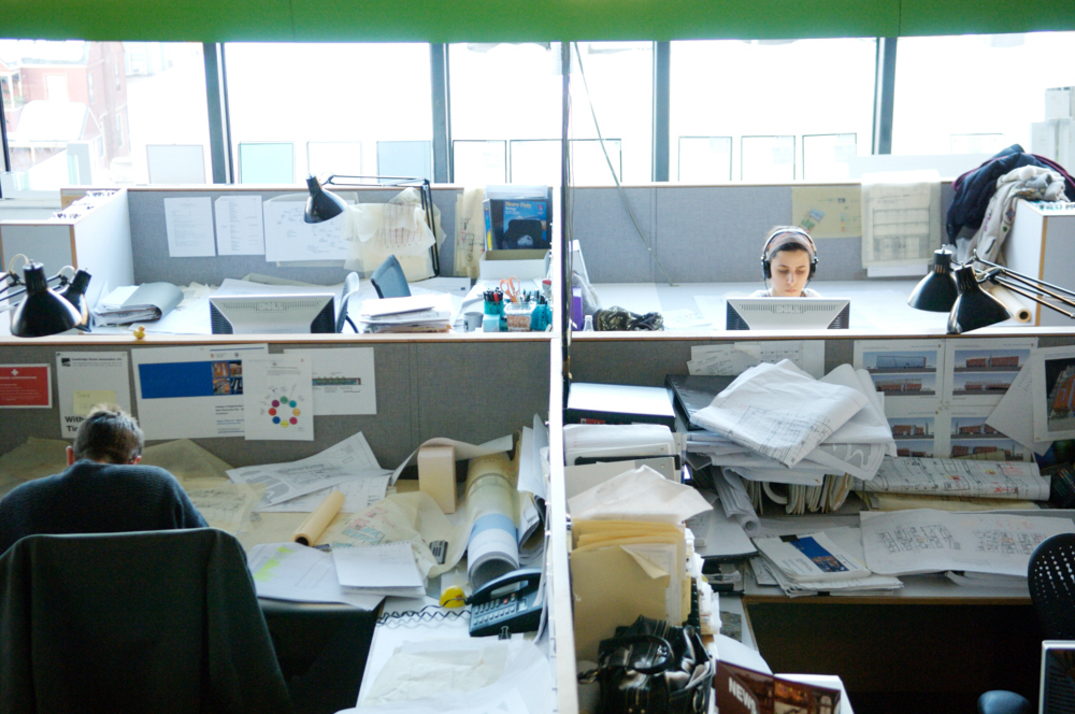 Overhead shot of people working in office cubicles