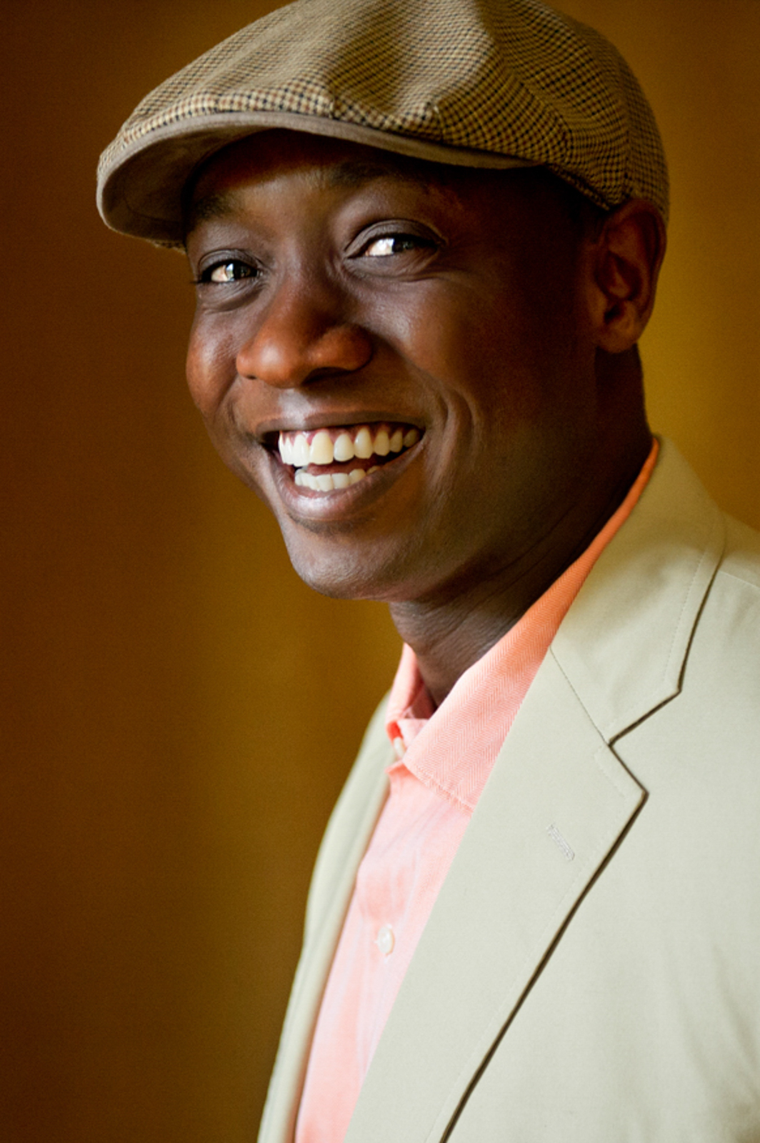 Portrait of man smiling wearing a hat